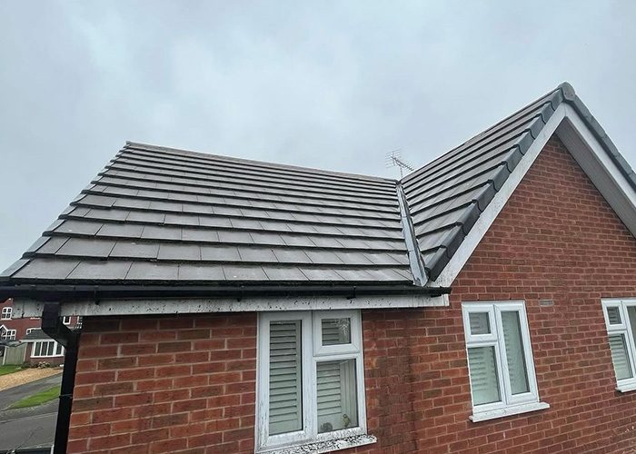 Bungalow roof tiles cleaned free of moss and algae in Shropshire