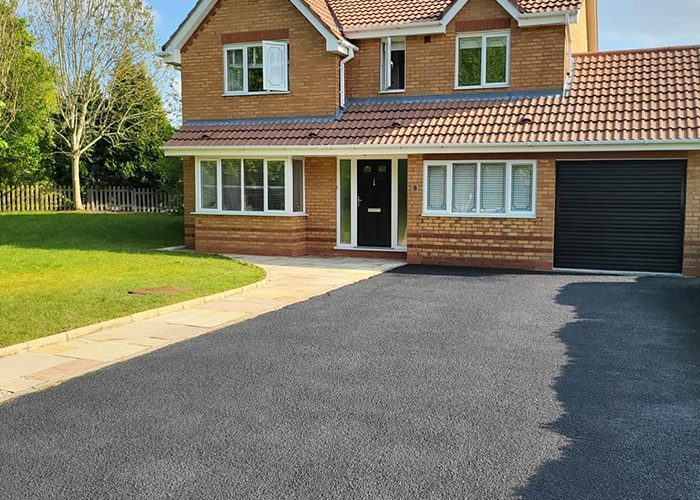 Freshly pressure-washed driveway in front of a detached Shropshire home
